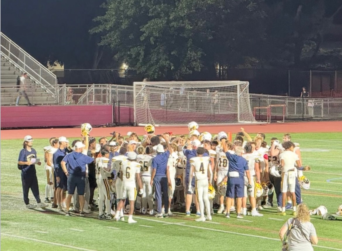 Wiss Football gathering together to celebrate their victory over the Cardinals