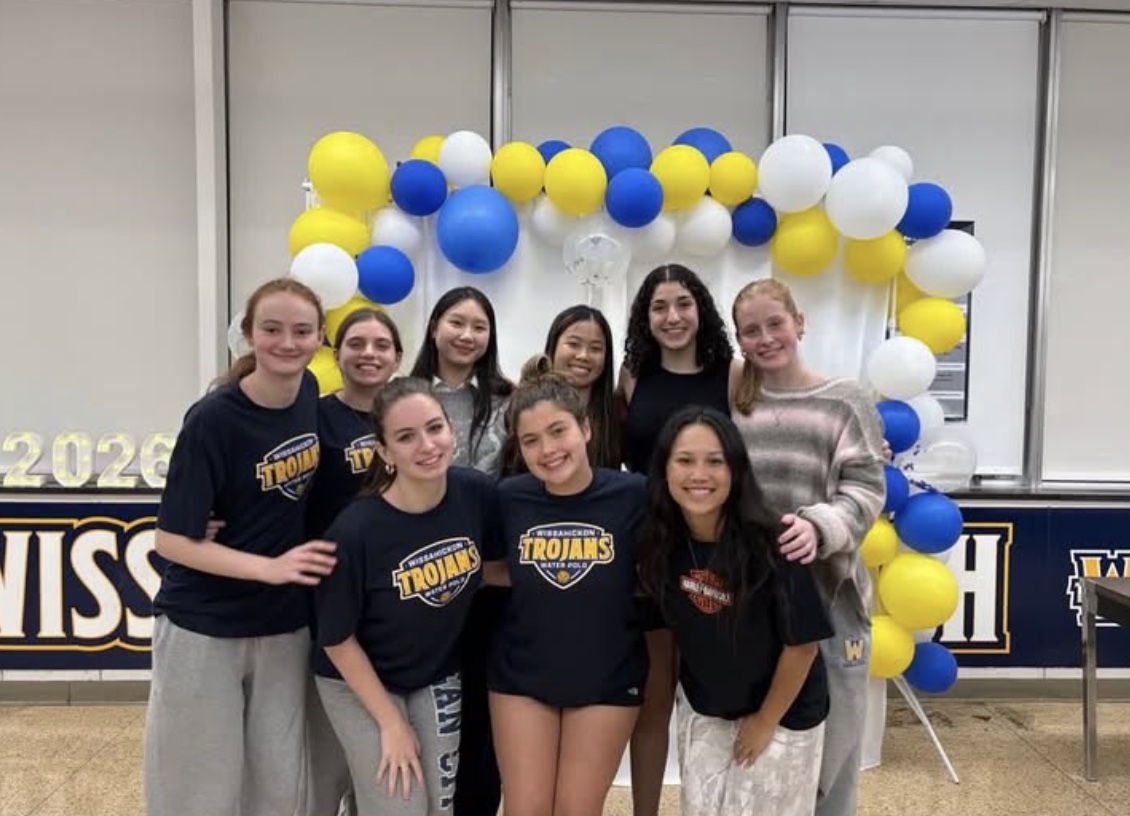 Girls’ Water Polo seniors pose for a picture after celebrating their Senior Night 